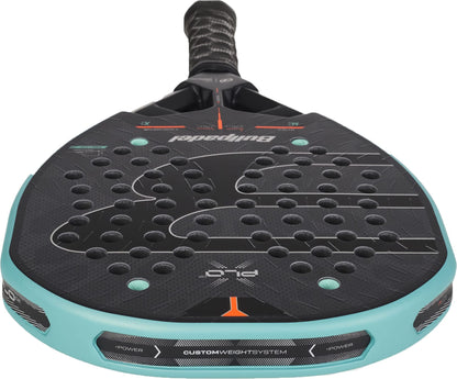 Close-up of a Bullpadel Xplo 2027 Padel Racket featuring a black and turquoise design, perforated with holes, and “Custom Weight System” text visible on the frame—perfect for players seeking maximum power on the court.
