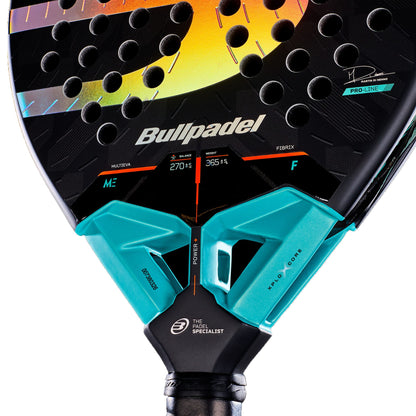 Close-up of the Bullpadel Xplo Comfort 2027 Padel Racket by Bullpadel, featuring prominent branding, technical specifications, and a vibrant design highlighted by turquoise accents near the handle. The image emphasizes its innovative MultiEva core and resilient Fibrix surface, designed for superior performance.